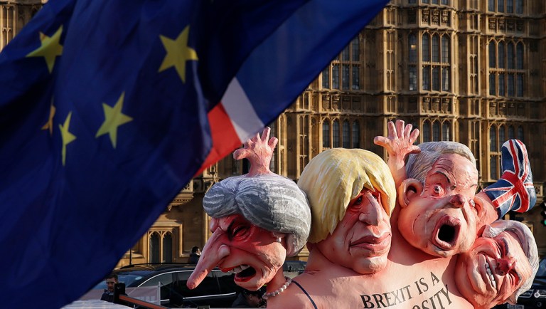 Flags fly above an anti-Brexit sculpture outside the Houses of Parliament.