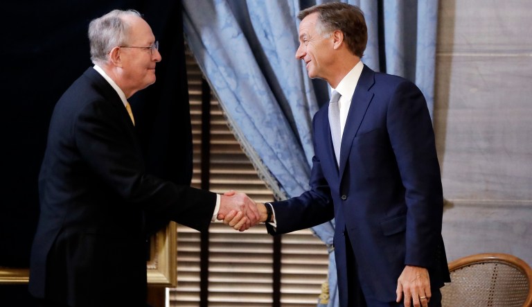 U.S. Sen. Lamar Alexander, R-Tenn., left, shakes hands with Tennessee Gov. Bill Haslam before the unveiling of Haslam's official portrait Monday, Dec. 17, 2018, in Nashville, Tenn. Alexander said Monday he is not running for re-election in 2020. 