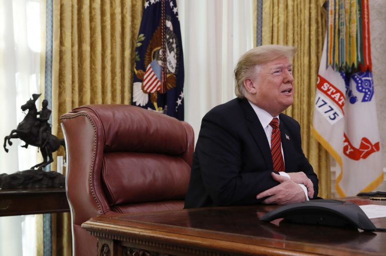 President Trump greets members of the five branches of the military by video conference on Christmas Day, Tuesday, Dec. 25, 2018, in the Oval Office of the White House.
