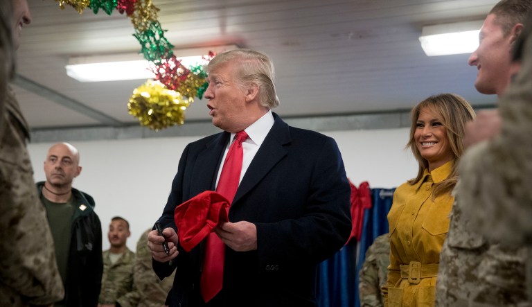 President Trump and first lady Melania Trump visit with troops at a dining hall at Al Asad Air Base, Iraq.