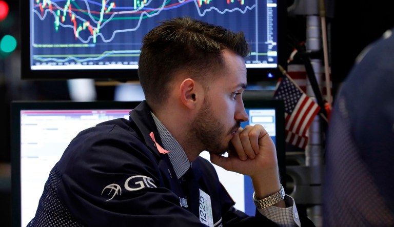 Specialist Matthew Greiner works at his post on the floor of the New York Stock Exchange, Friday, Dec. 28, 2018. U.S. stocks wavered between small gains and losses Friday, struggling to maintain the momentum from a two-day winning streak following a week of volatile trading.