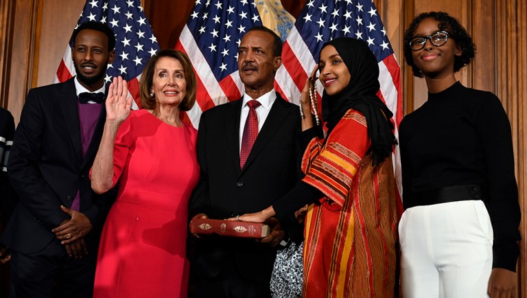 House Speaker Nancy Pelosi of Calif., second from left, poses during a ceremonial swearing-in with Rep. Ilhan Omar, D-Minn., second from right, on Capitol Hill in Washington, Thursday, Jan. 3, 2019, during the opening session of the 116th Congress. 