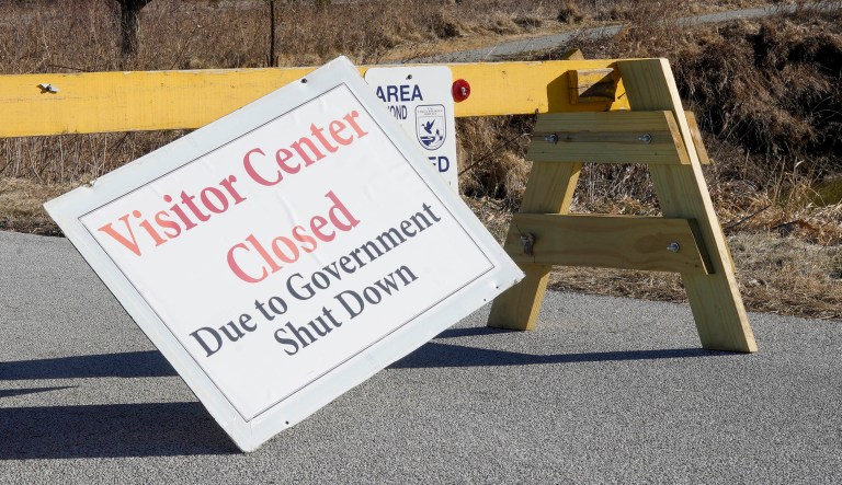 Signs announce the visitor center at the DeSoto National Wildlife Refuge in Missouri Valley, Iowa, is closed as the partial government shutdown continues.