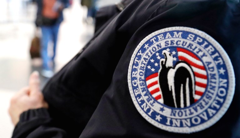 A TSA worker works at O'Hare International Airport in Chicago.