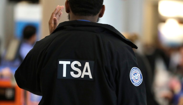 A Transportation Security Administration officer works at a checkpoint at Miami International Airport, Sunday, Jan. 6, 2019, in Miami.