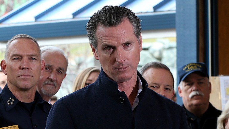 Gov. Gavin Newsom listens to a reporter's question.