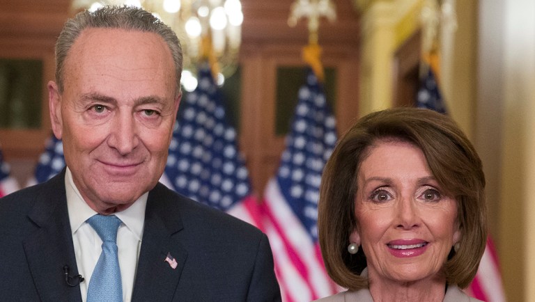 Senate Minority Leader Chuck Schumer of N.Y., and House Speaker Nancy Pelosi of Calif., pose for photographers.