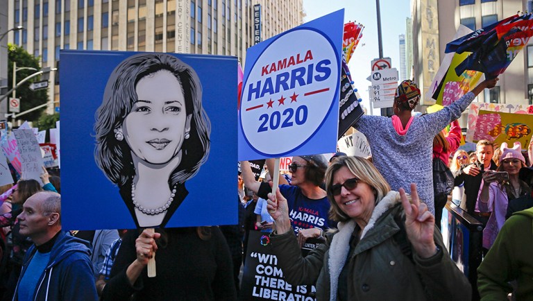 Demonstrators hold posters of Kamala Harris 2020 during the Women's March.