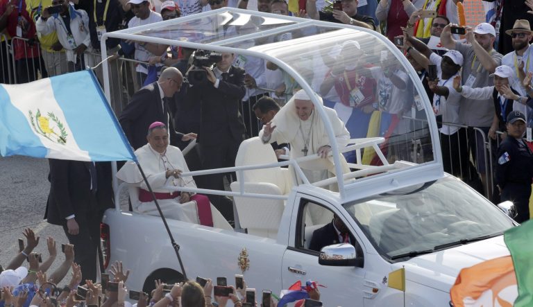 Pope Francis waves to the crowd as he rides in the popemobile to attend a mass in Panama City, Thursday, Jan. 24, 2019. Pope Francis has arrived in Panama amid a political crisis in nearby Venezuela, a migration standoff over the proposed U.S.-Mexico border wall.
