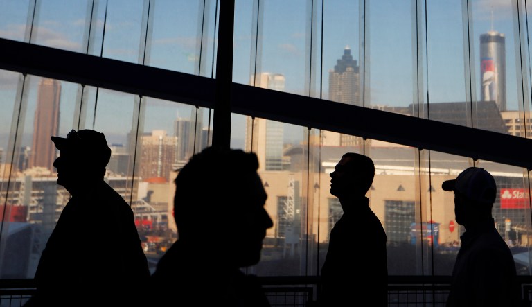 Fans walk in the Mercedes-Benz Stadium before the NFL Super Bowl 53 football game between the Los Angeles Rams and the New England Patriots Sunday, Feb. 3, 2019, in Atlanta.