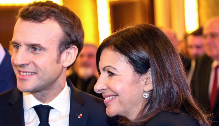 French President Emmanuel Macron and Paris Mayor Anne Hidalgo attend the annual dinner of the Co-ordination Council of Armenian organisations of France on Tuesday Feb. 5, 2019, in Paris. 