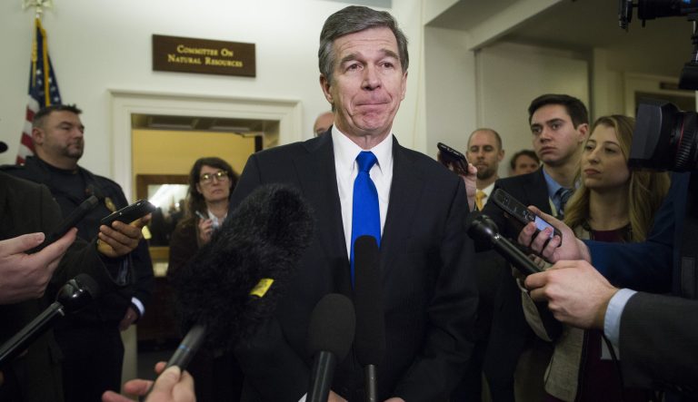 North Carolina Gov. Roy Cooper speaks with reporters on Capitol Hill in Washington, Wednesday, Feb. 6, 2019. 