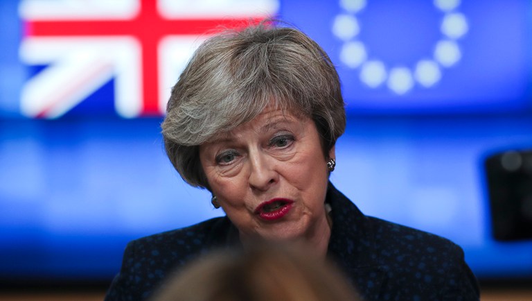 Britain's Prime Minister Theresa May talks to journalists after her meeting.
