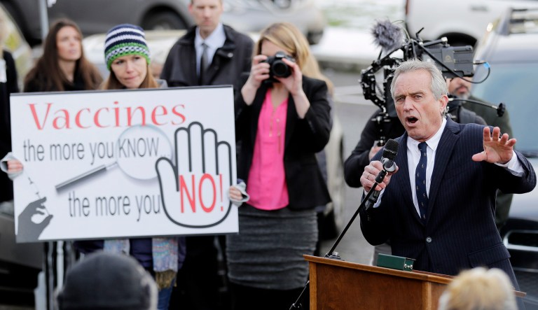 Robert Kennedy Jr., right, speaks at a rally held in opposition to a proposed bill that would remove parents' ability to claim a philosophical exemption to opt their school-age children out of the combined measles, mumps and rubella vaccine in Olympia, Wash.
