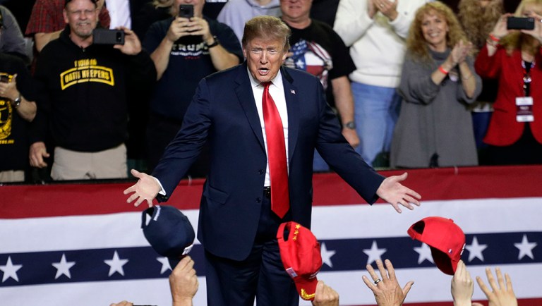 President Trump arrives to speak at a rally.