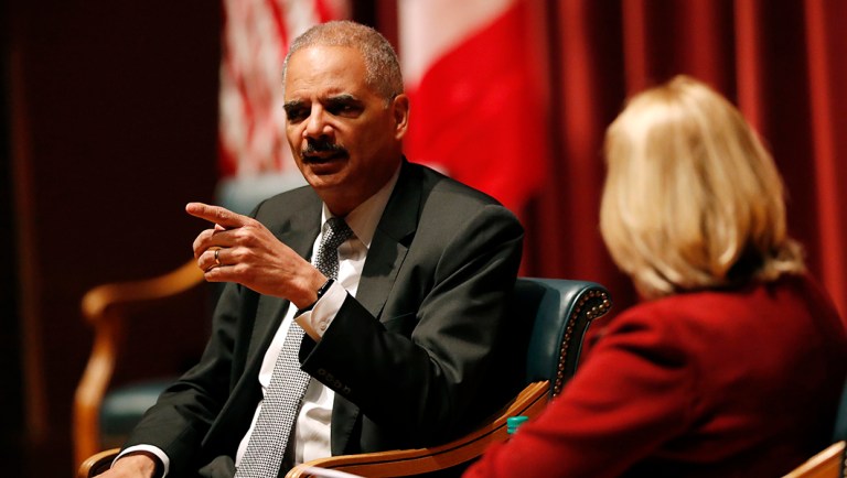 Former Attorney General Eric Holder answers a question.