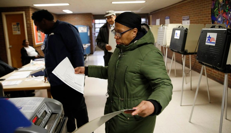 Stephanie Arnold votes at the polling place inside South Shore Fine Arts Academy in Chicago on Tuesday.