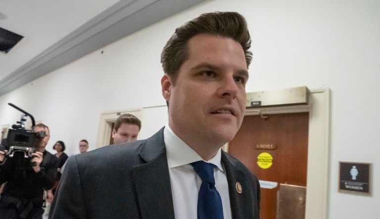 Rep. Matt Gaetz, R-Fla., walks down a hallway.