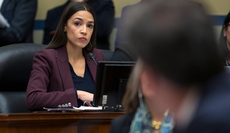 Rep. Alexandria Ocasio-Cortez, D-N.Y., listens to a response to her question of Michael Cohen, President Donald Trump's former lawyer, as he testifies before the House Oversight and Reform Committee, on Capitol Hill, Wednesday, Feb. 27, 2019, in Washington.