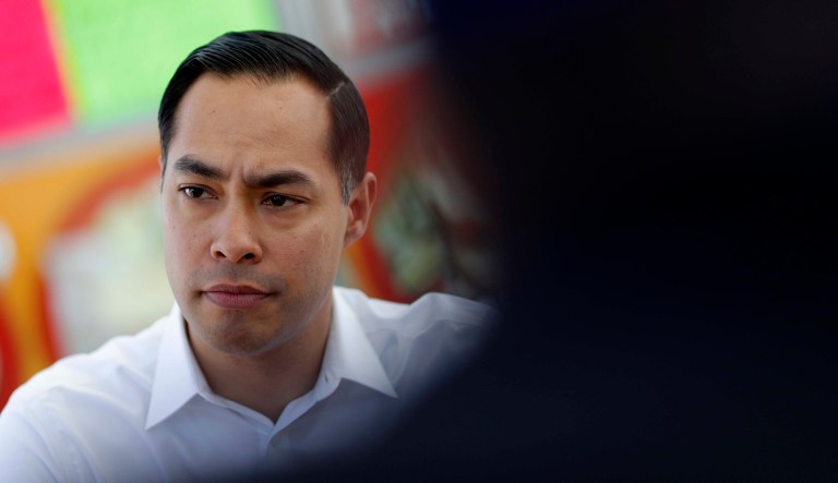 Former Housing and Urban Development Secretary and Democratic presidential candidate Julian Castro visits with people at a taco truck, Thursday, Feb. 28, 2019, in North Las Vegas, Nev.