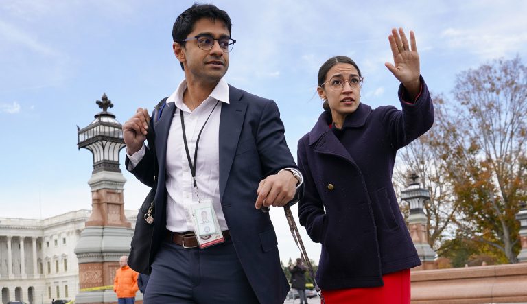 Rep. Alexandria Ocasio-Cortez, D-N.Y., right, and her chief of staff Saikat Chakrabarti, left, walk back together in Capitol Hill in Washington, Wednesday, Nov. 14, 2018. 