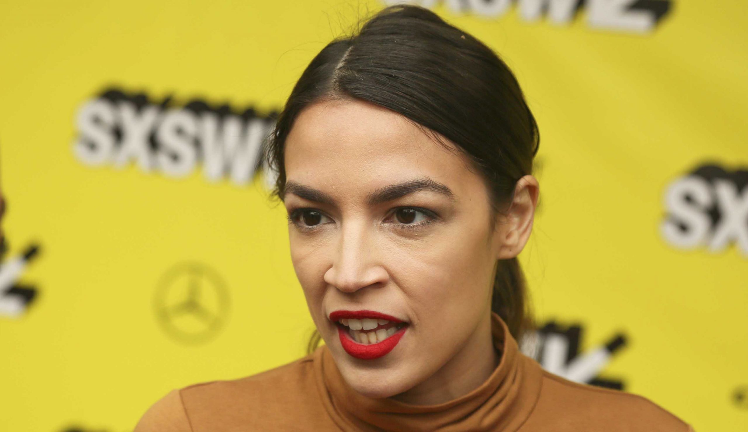 AOC accuses Trump of ‘setting racist tone’
