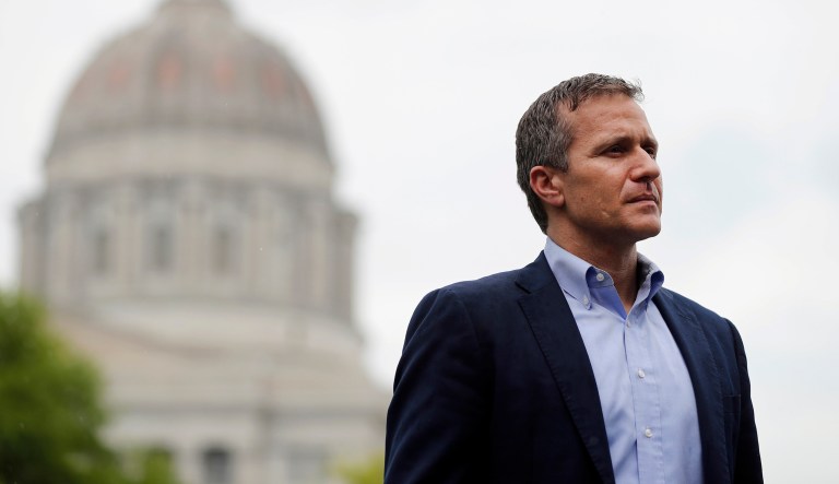 In this May 17, 2018, photo, Missouri Gov. Eric Greitens stands off to the side before stepping up to the podium to deliver remarks to a small group of supporters near the capitol announcing the release of funds for the state's biodiesel program in Jefferson City, Mo.