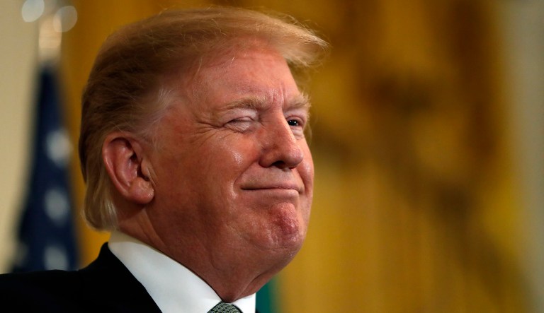 President Trump winks during the annual presentation of a bowl of shamrocks with Irish Prime Minister Leo Varadkar, Thursday, March 14, 2019, in the East Room of the White House in Washington.