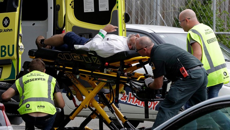 Ambulance staff take a man from outside a mosque in central Christchurch, New Zealand.