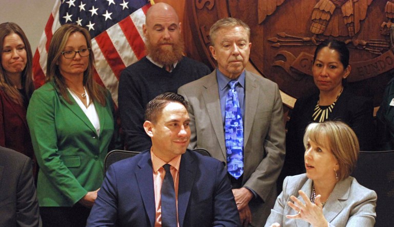 New Mexico Gov. Michelle Lujan Grisham, front right, highlights accomplishments by lawmakers at the close of a 60-day legislative session on Saturday, March 16, 2019, at her offices in Santa Fe, N.M. 