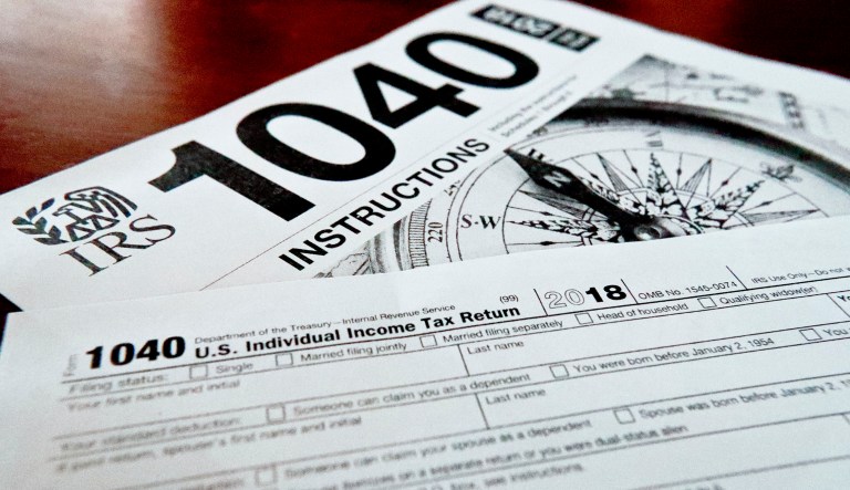 Multiple forms printed from the Internal Revenue Service web page that are used for 2018 U.S. federal tax returns are shown.