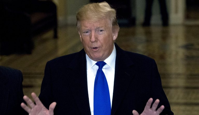 President Donald Trump talks to reporters as he arrives for a Senate Republican policy lunch on Capitol Hill in Washington, Tuesday, March 26, 2019. 