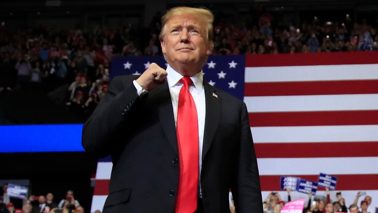 President Trump arrives to speak at a rally in Grand Rapids, Mich.