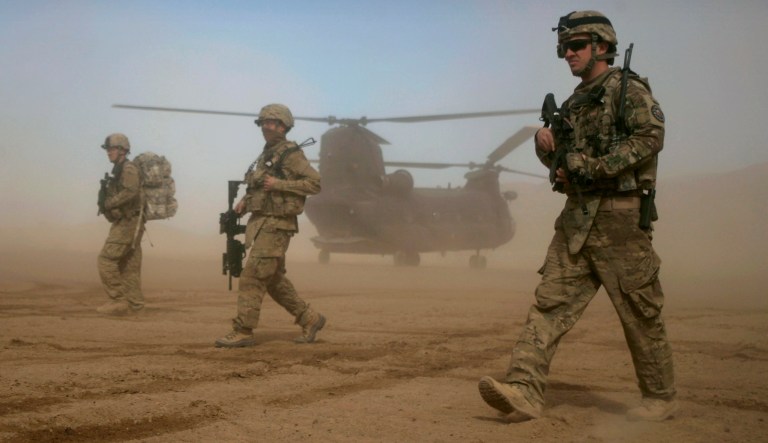 U.S. soldiers, part of the NATO- led International Security Assistance Force (ISAF) walk west of Kabul, Afghanistan.