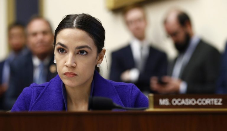 Rep. Alexandria Ocasio-Cortez, D-N.Y., listens during a House Financial Services Committee hearing with leaders of major banks, Wednesday, April 10, 2019, on Capitol Hill in Washington. 