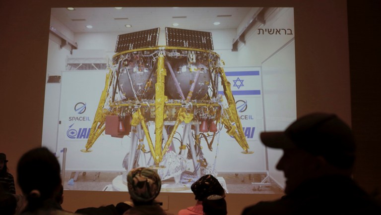 People watch the live broadcast of the SpaceIL spacecraft as it lost contact with Earth in Netanya, Israel.