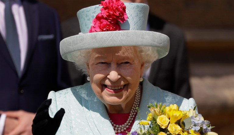 Britain's Queen Elizabeth II waves to the public as she leaves after attending the Easter Mattins Service at St. George's Chapel, at Windsor Castle in England Sunday, April 21, 2019. 