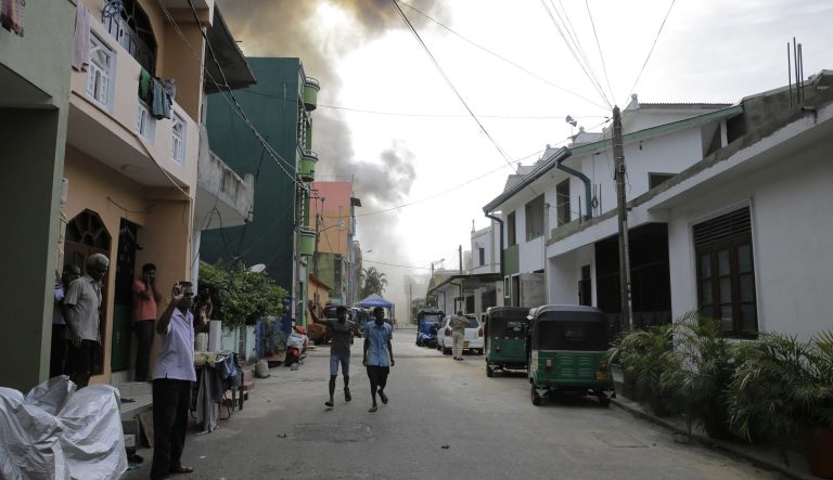 Smoke rises after a vehicle parked near St. Anthony's shrine exploded in Colombo, Sri Lanka, Monday, April 22, 2019. Easter Sunday bombings that ripped through churches and luxury hotels killed more than 200 people. 
