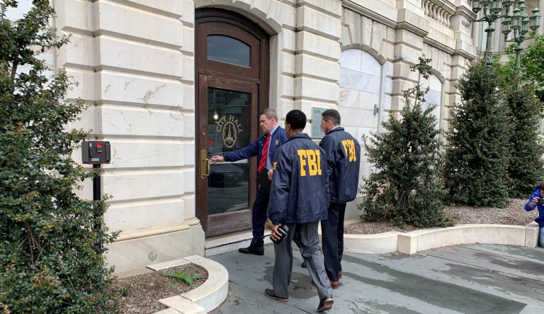 Federal Bureau of Investigation and Internal Revenue Service agents enter City Hall in Baltimore, MD., on Thursday, April 25, 2019. FBI, IRS launched raids connected to Baltimore Mayor Catherine Pugh amid widening probes to determine whether she used sales of her children's books to disguise government kickbacks. 