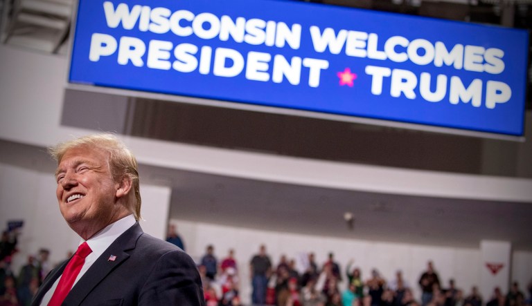 President Trump smiles while speaking at a rally at Resch Center Complex in Green Bay, Wis.