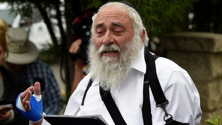 Rabbi Yisroel Goldstein speaks at a news conference.