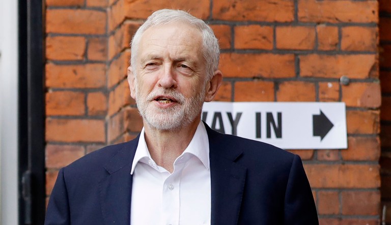 Jeremy Corbyn, leader of Britain's opposition Labour Party, leaves a building.