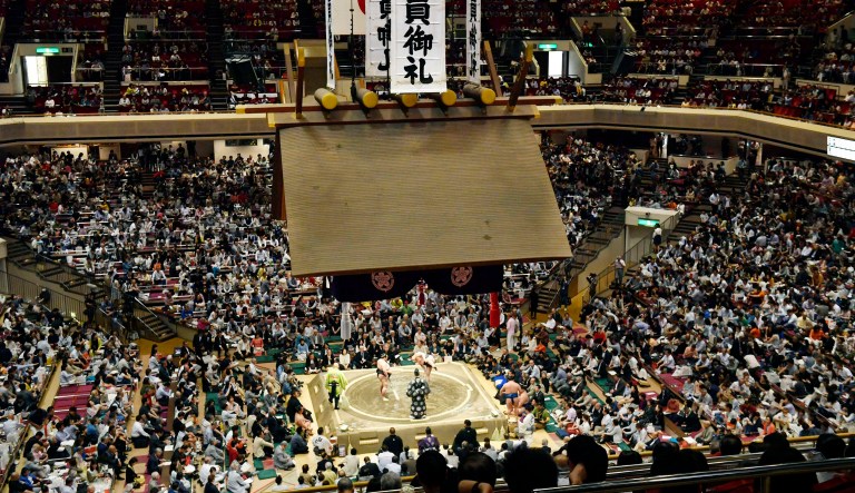 In this May 12, 2019, file photo, banners thanking for a sellout crowd are displayed on the first day of Summer Grand Sumo Tournament in Tokyo. U.S. President Donald Trumpâs Japan visit starting on Saturday, May 25, 2019, is to focus on personal ties with Japanese Prime Minister Shinzo Abe rather than substantive results on trade, security or North Korea. Then the two leaders and their wives will watch sumo together in the evening before a restaurant dinner.
