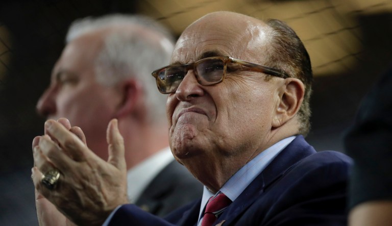 Former New York City Mayor Rudy Giuliani watches during the seventh-inning stretch of a baseball game between the New York Yankees and the Boston Red Sox, Friday, May 31, 2019, in New York. 