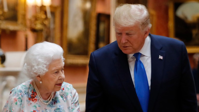 Britain's Queen Elizabeth speaks to President Trump and first lady Melania Trump.