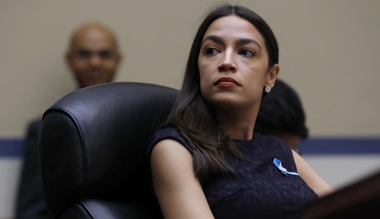 Rep. Alexandria Ocasio-Cortez, D-N.Y., listens during a hearing in D.C.
