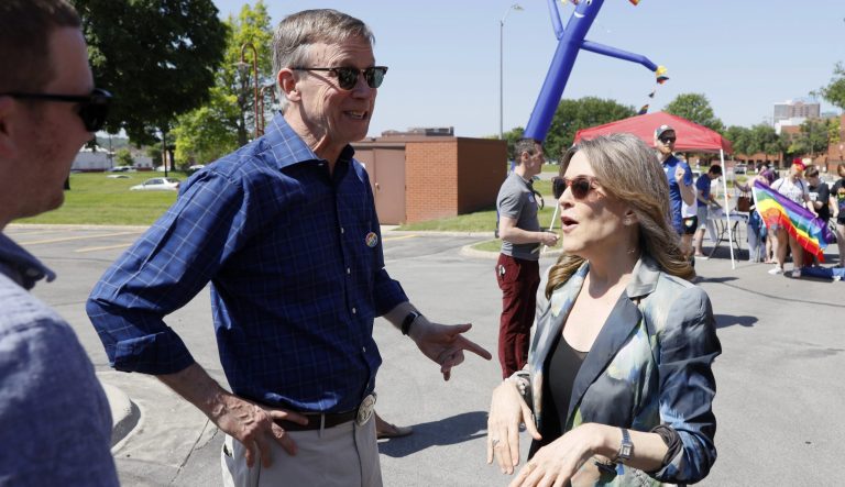 Democratic presidential candidate John Hickenlooper talks with fellow Democratic presidential candidate Marianne Williamson, right, during the Capital City Pride Fest, Saturday, June 8, 2019, in Des Moines, Iowa. 