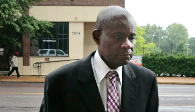 Former FBI agent William Don Tisaby turns himself in at St. Louis Police headquarters on Monday in St. Louis.