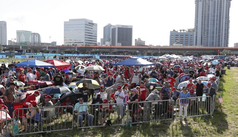 Supporters of President Donald Trump wait in line hours before the arena doors open for a campaign rally Tuesday, June 18, 2019, in Orlando, Fla. 