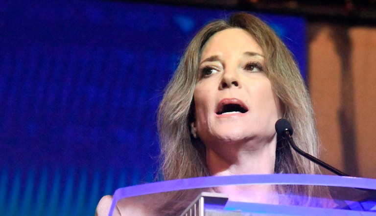 Author Marianne Williamson addresses a crowd.